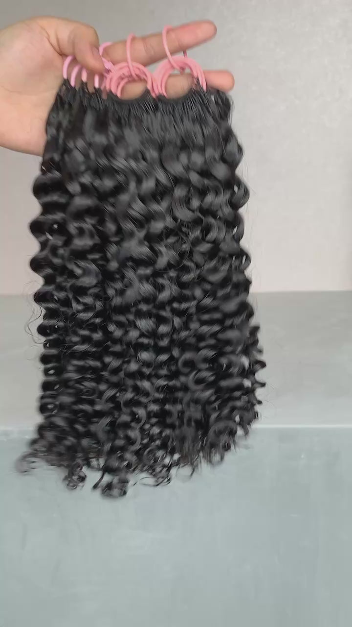 BrisRawHairCo’s Feather Crochet Hair